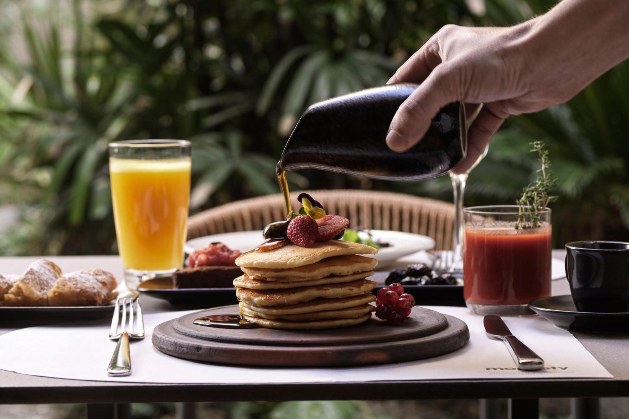 Hotel Monasty, Thessaloniki, Autograph Collection Exterior foto Maple syrup being poured on a stack of pancakes